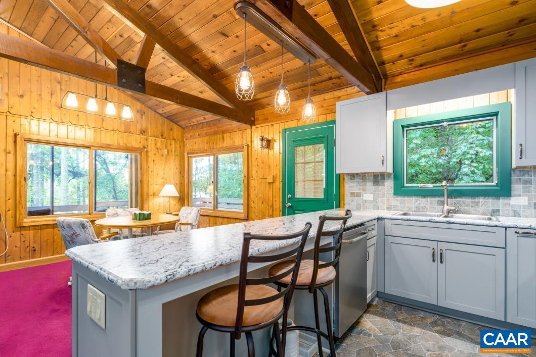237 Westwood Road Stanardsville, VA 22973 - Photo 4 of 47 a dining hall with stainless steel appliances granite countertop a sink and cabinets