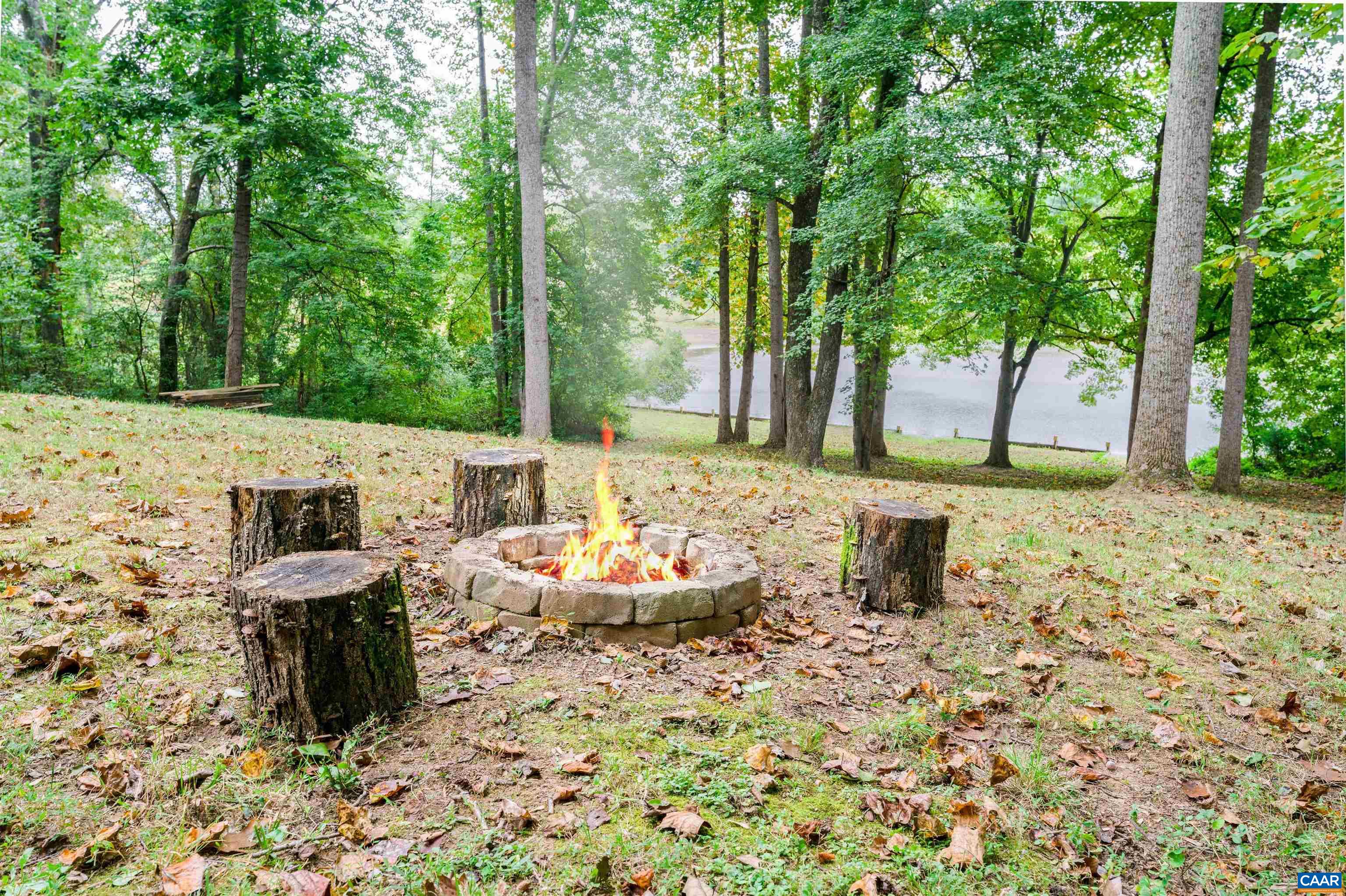 237 Westwood Road Stanardsville, VA 22973 - Photo 44 of 47 a backyard of a house with table and chairs