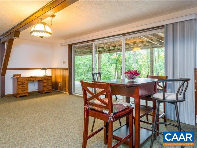 237 Westwood Road Stanardsville, VA 22973 - Photo 5 of 47 a dining room with furniture and a floor to ceiling window