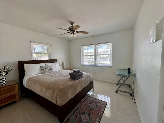 a bedroom with a bed furniture and a window