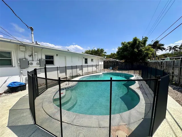 a view of a swimming pool with a patio