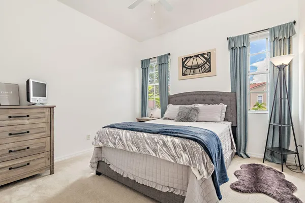 a bedroom with a bed and a television