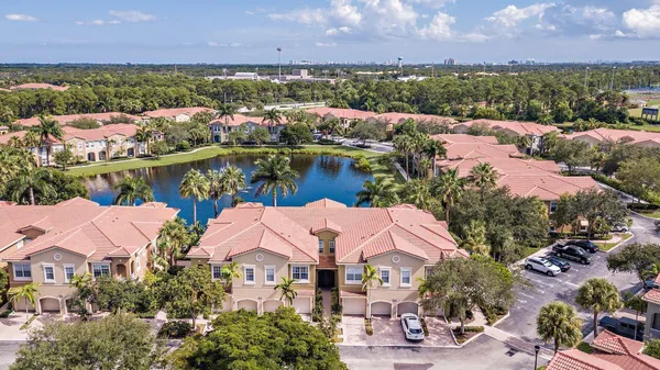 an aerial view of lake and residential houses with outdoor space and lake view