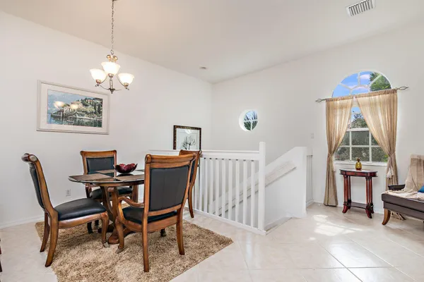 a view of a dining room with furniture window and outside view