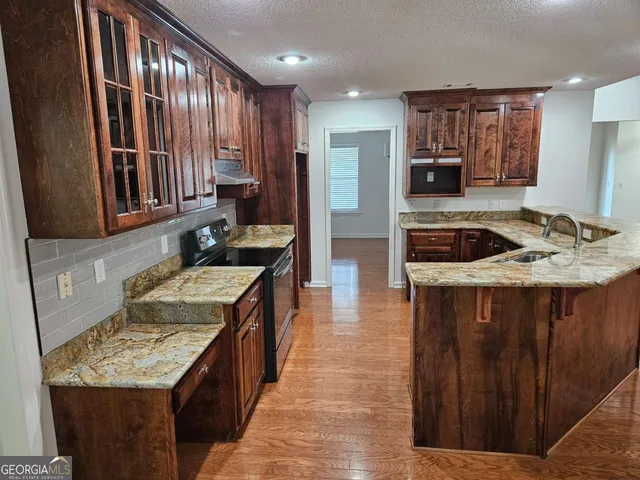 an empty room with wooden floor