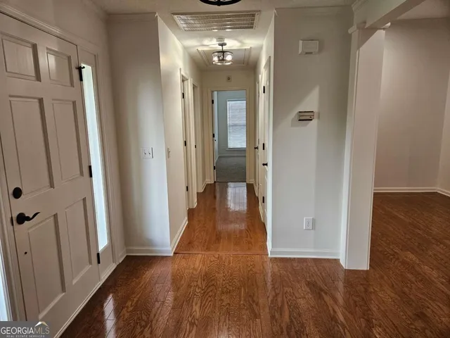 a bathroom with a sink and a mirror with shower