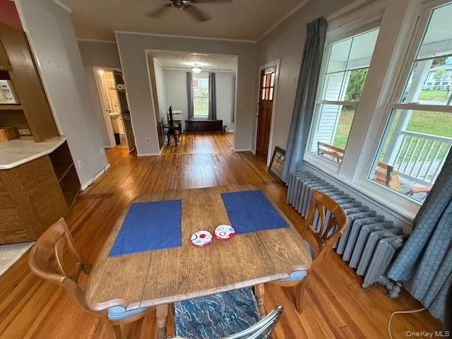 a view of an entryway with wooden floor