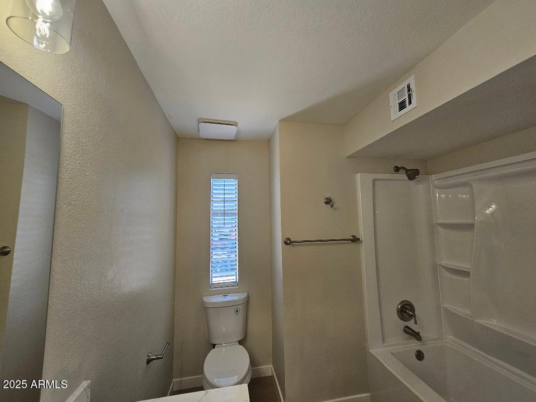 2020 West Union Hills Drive, Unit 116 Phoenix, AZ 85027 - Photo 19 of 28 a bathroom with a shower a toilet and a sink