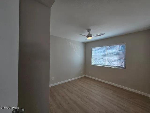 a bathroom with a shower a toilet and a sink