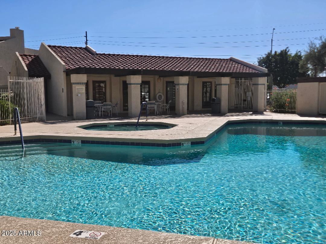 2020 West Union Hills Drive, Unit 116 Phoenix, AZ 85027 - Photo 25 of 28 a front view of a house with a yard
