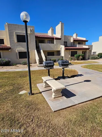 a view of a swimming pool with a patio