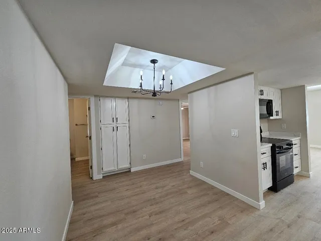 a kitchen with a sink stove and microwave
