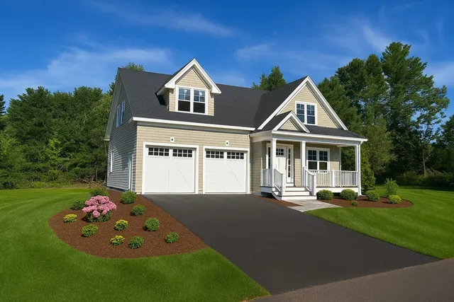 a front view of a house with a yard table and chairs