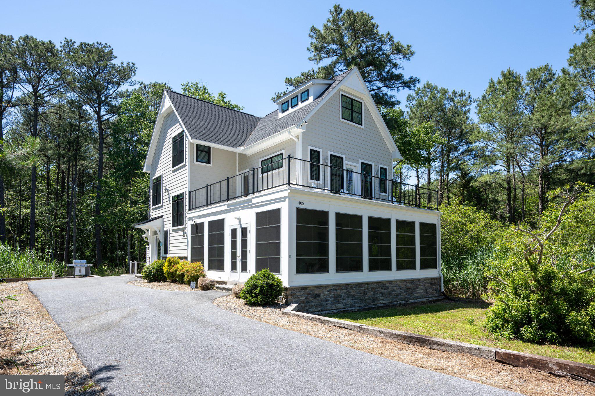 402 Salt Pond Road Bethany Beach, DE 19930 - Photo 3 of 55 Charming home nestled in serene woods.