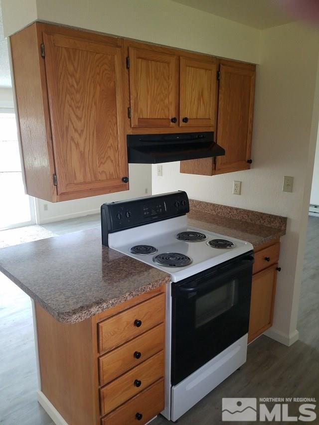 3420 Brant Street Reno, NV 89508 - Photo 8 of 20 a kitchen with granite countertop cabinets and steel stainless steel appliances