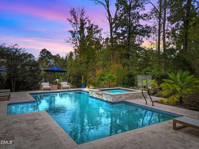 a view of a couches and table in deck with wooden floor
