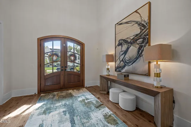 a view of an entryway with wooden floor