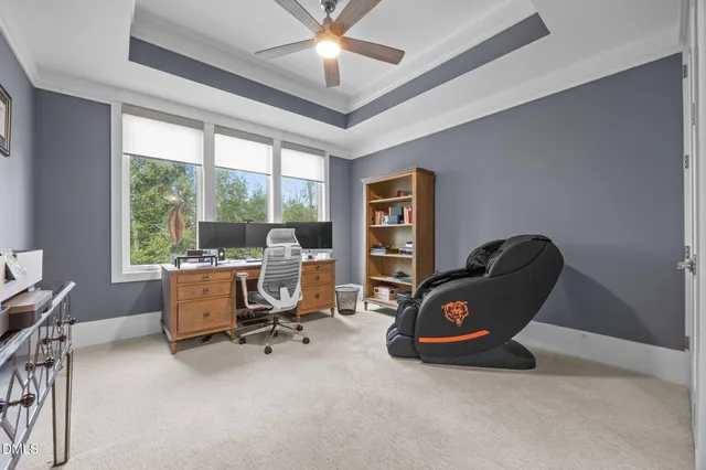 a view of a room with wooden floor and bathroom