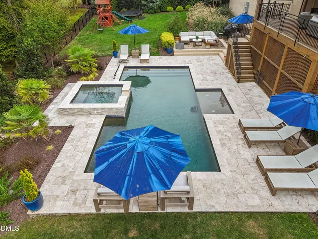 a view of a swimming pool with a lounge chairs