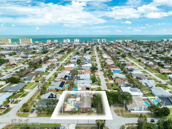 an aerial view of residential building with parking space