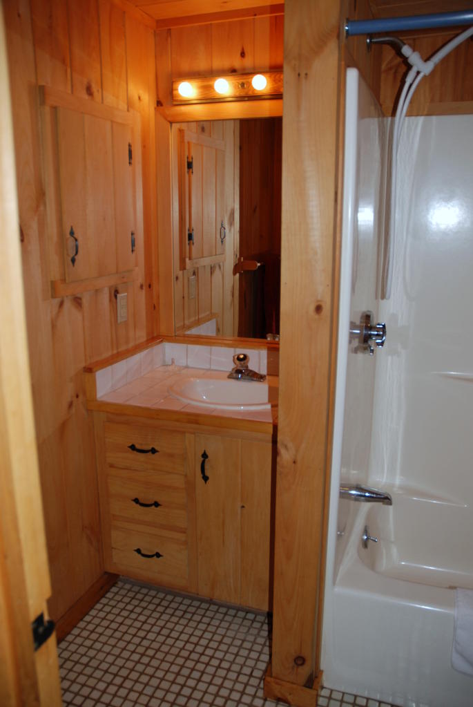 221 Judd Road Otis, MA 01253 - Photo 20 of 23 a bathroom with a granite countertop sink and a mirror