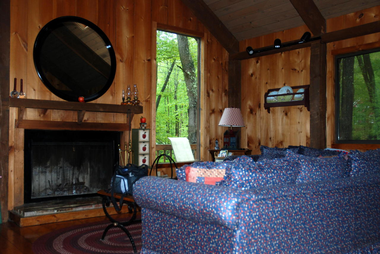 221 Judd Road Otis, MA 01253 - Photo 4 of 23 a living room with furniture and a fireplace