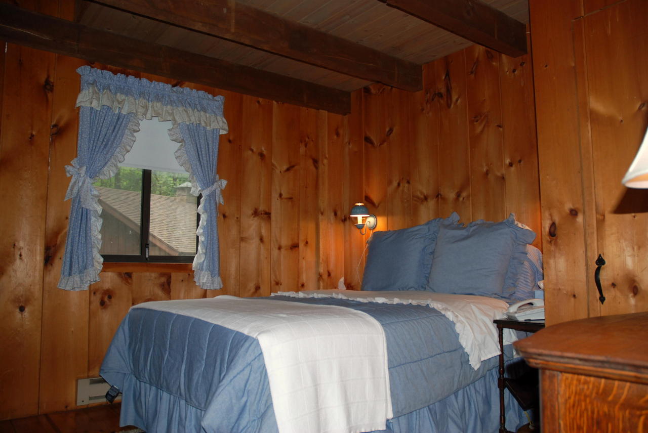 221 Judd Road Otis, MA 01253 - Photo 8 of 23 a bedroom with a bed and a mirror
