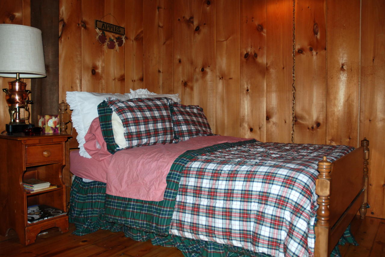 221 Judd Road Otis, MA 01253 - Photo 9 of 23 a bedroom with a bed and a lamp on the dresser