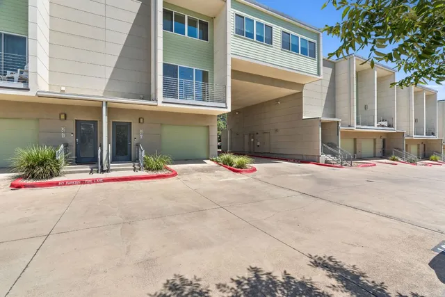 a view of a house with potted plants