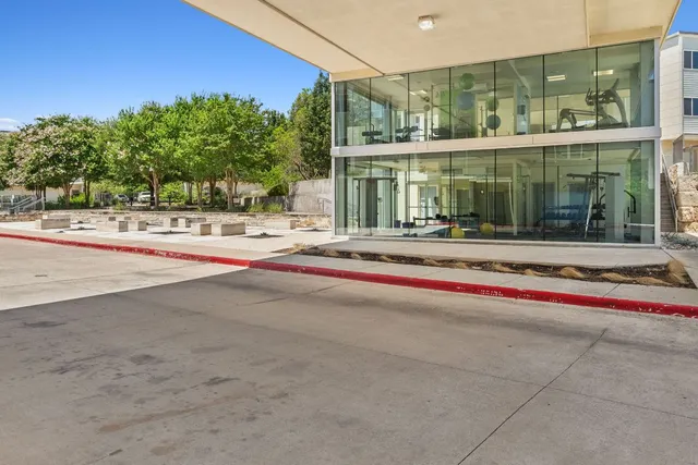 a outdoor view of building with traffic signal lights