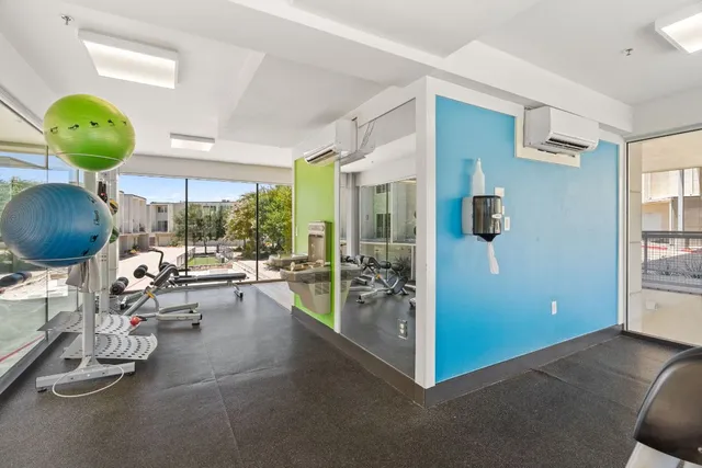 a view of a livingroom with table and chairs