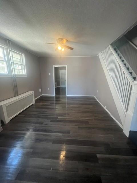 126 East High Street Coaldale, PA 18218 - Photo 4 of 15 Rich hardwood floors complement the neutral tones in this inviting living space, leading to a pristine staircase.