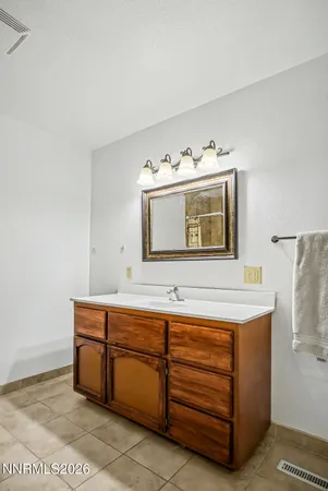 a room with a sink and a mirror