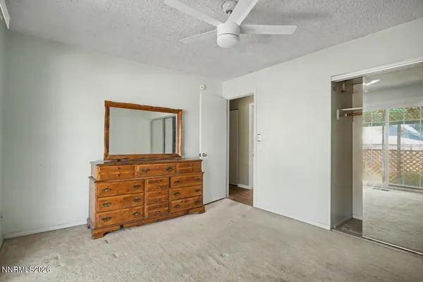 a room with furniture and a dresser