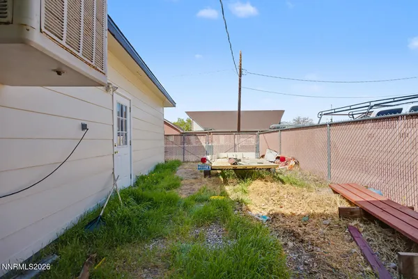 a view of a backyard with a patio