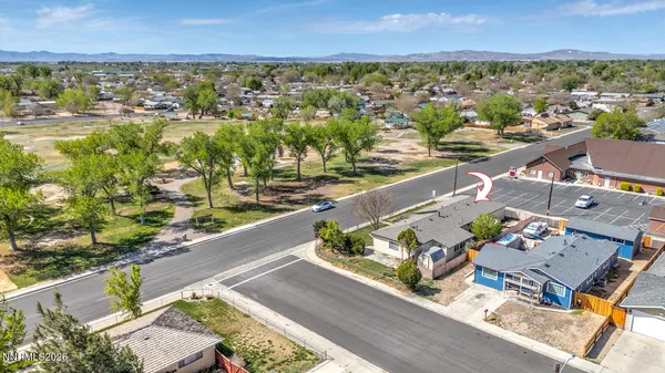 an aerial view of residential houses with outdoor space