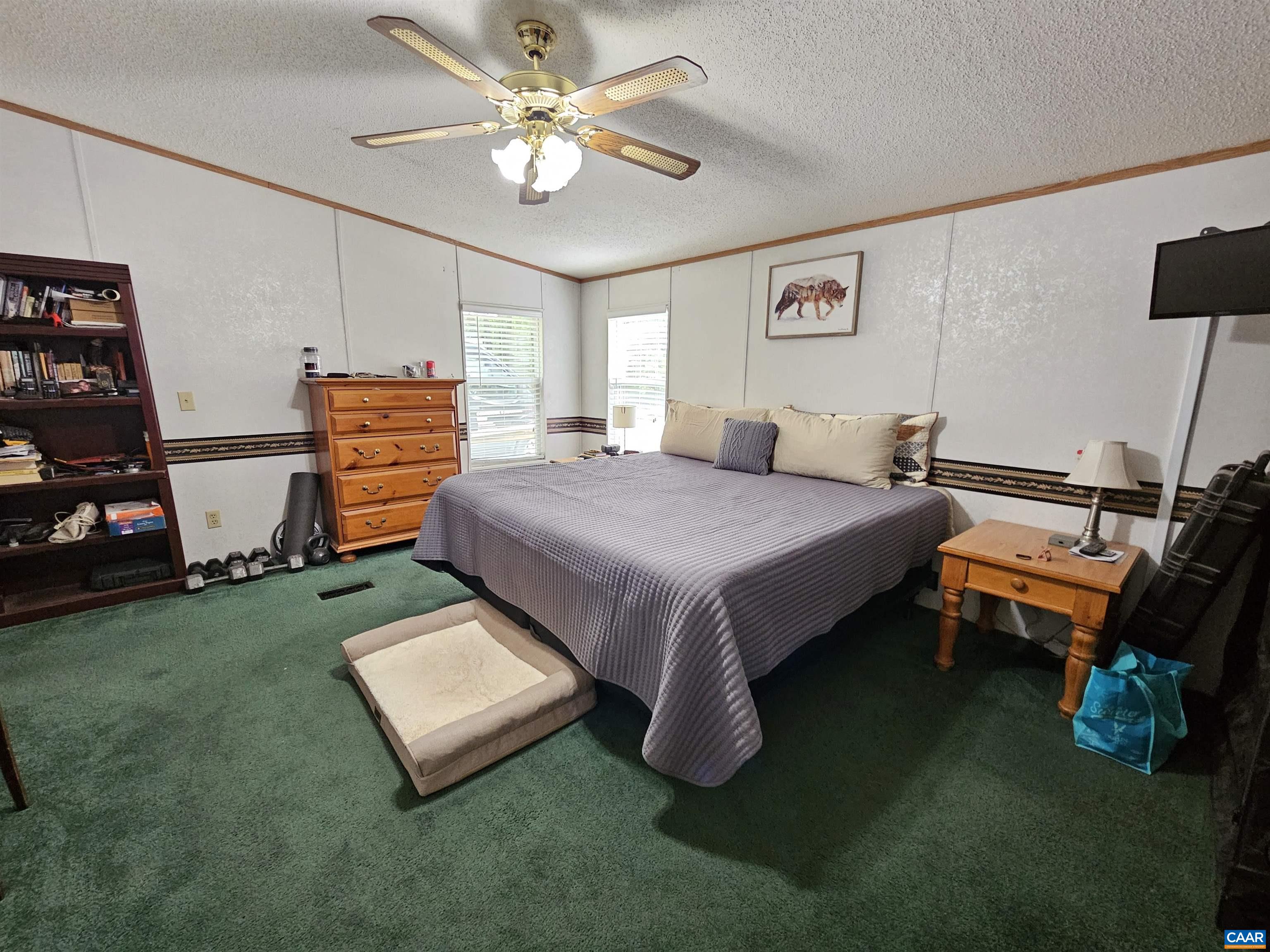 981 Scotts Bottom Road Dillwyn, VA 23936 - Photo 16 of 62 a bedroom with a bed furniture and a flat screen tv