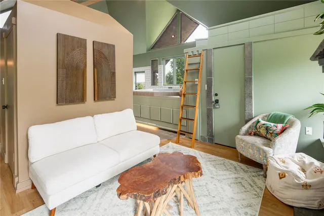 a view of a room with wooden floor