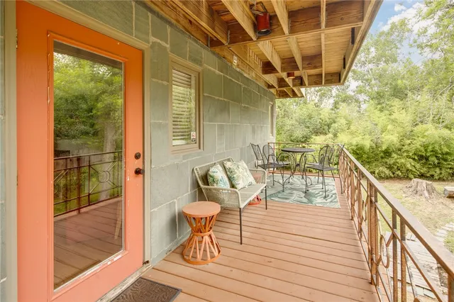 a balcony view with a seating space