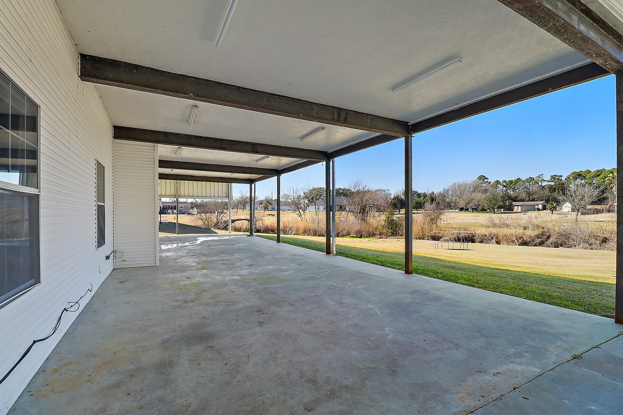 1306 Spring Branch Drive Baytown, TX 77523 - Photo 38 of 38 a view of a big room with an outdoor view and seating