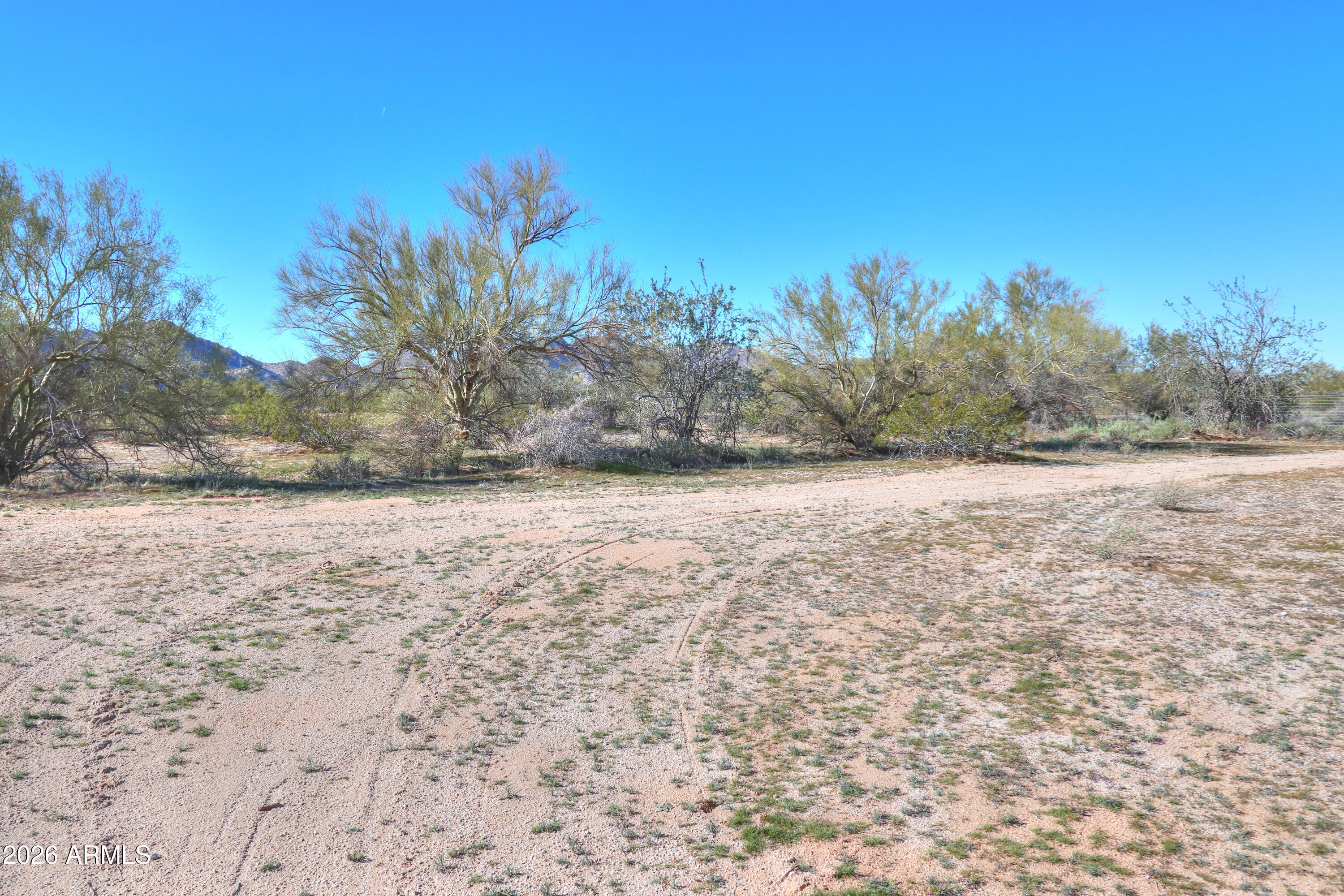 4 South Rincon Road, Unit 58 Maricopa, AZ 85139 - Photo 4 of 20 a view of a yard with a house