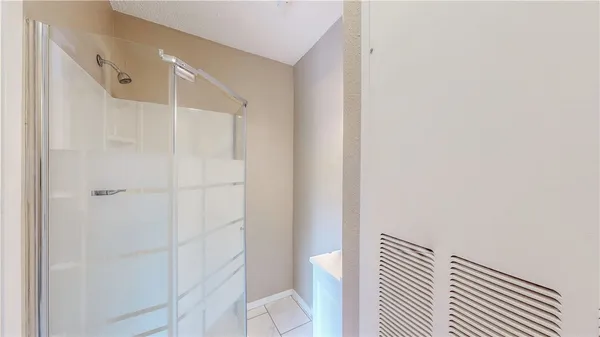 a bathroom with a shower and a toilet