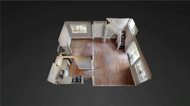 an aerial view of a house with a floor to ceiling window