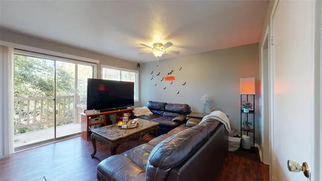 a view of a dining room with furniture and a wooden floor