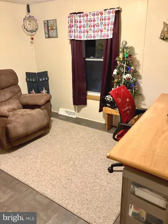 a bathroom with a sink toilet and shower curtain