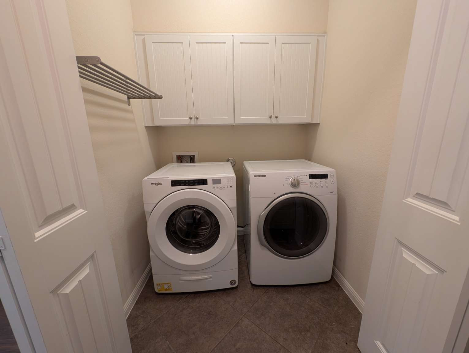 7301 Bandera Ranch Trail, Unit A Austin, TX 78750 - Photo 7 of 20 A well-appointed laundry room features cabinetry and appliances for ultimate convenience.