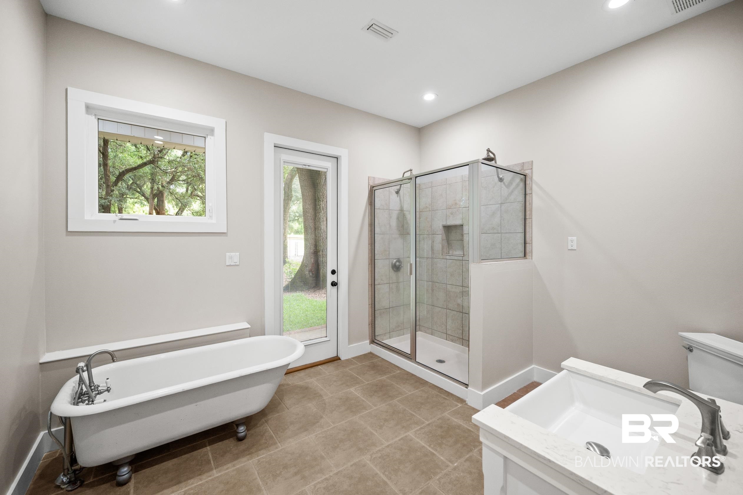 15031 Timber Ridge Drive Loxley, AL 36551 - Photo 21 of 43 Full bathroom with shower with separate bathtub, tile patterned flooring, and a wealth of natural light