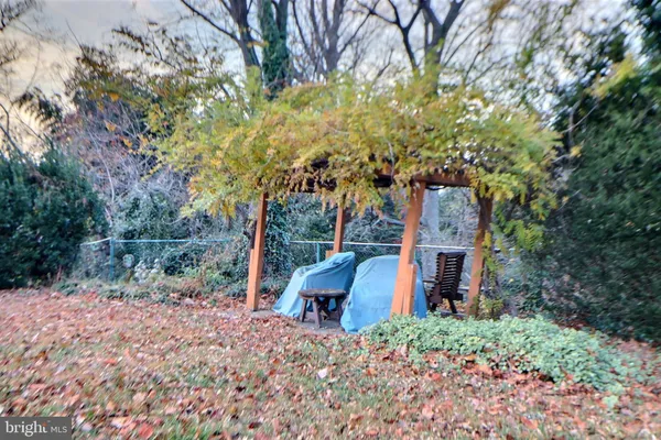 a backyard of a house with outdoor seating