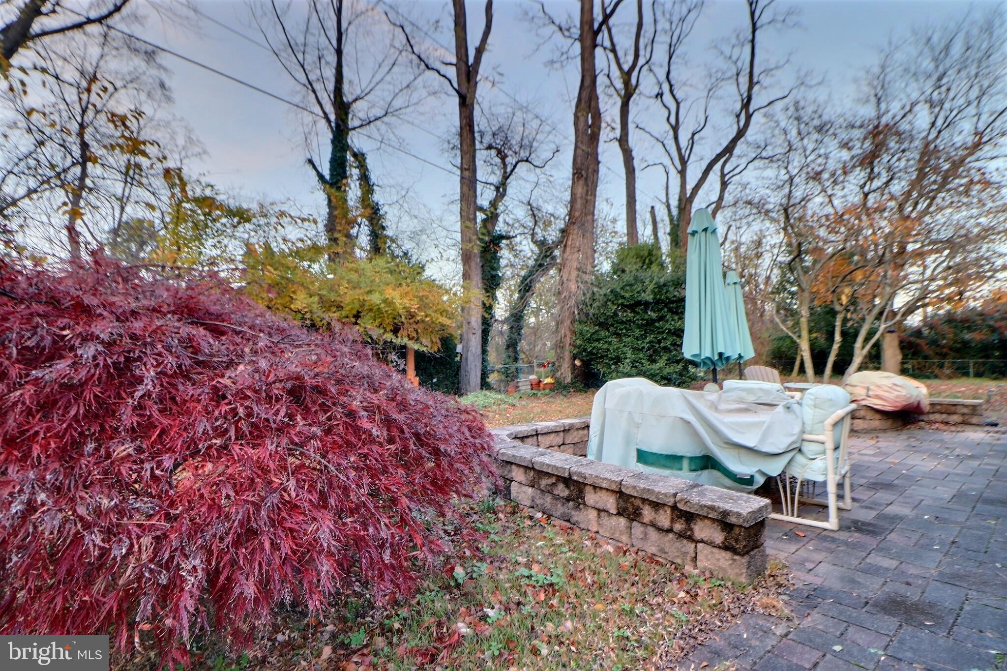 24 Forestview Place Willingboro, NJ 08046 - Photo 13 of 14 a backyard of a house with table and chairs