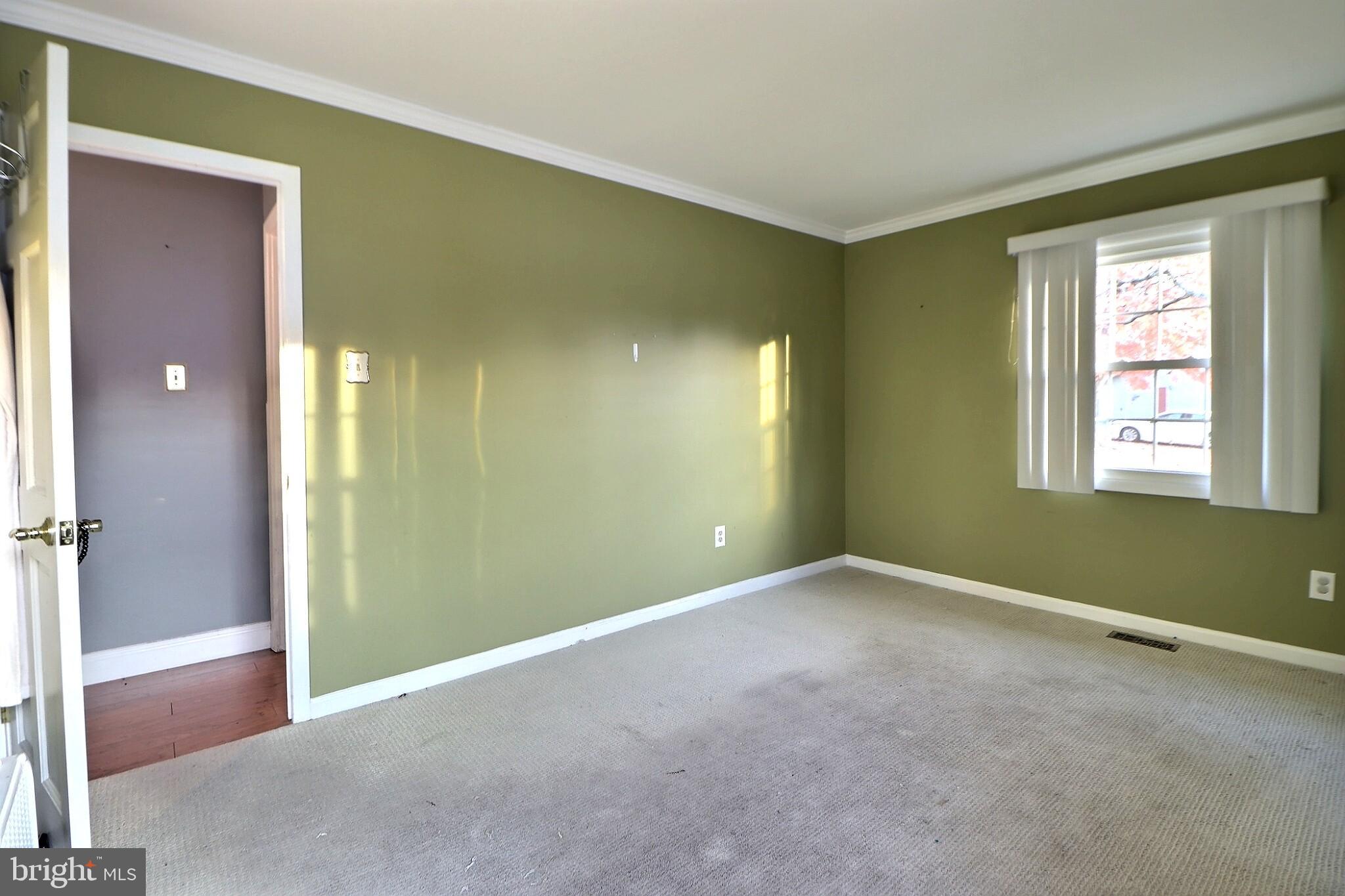 24 Forestview Place Willingboro, NJ 08046 - Photo 4 of 14 a view of an empty room with window and closet area